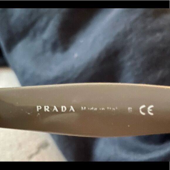 Prada “Polarized” Gray Sunglasses.